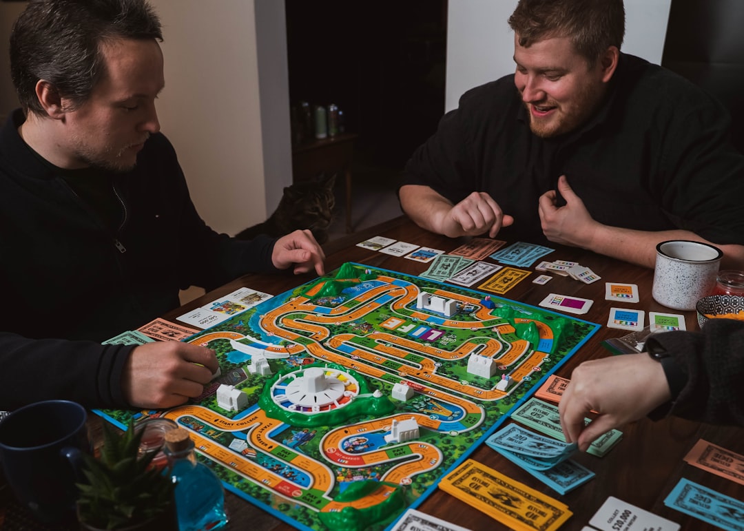 A group of friends play a classic board game.